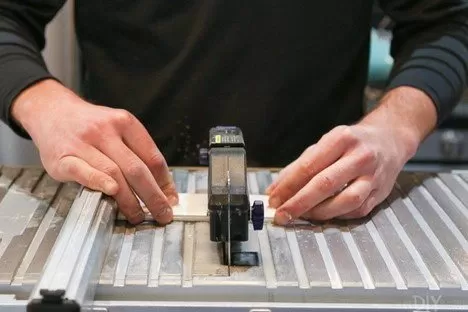 Cutting tiles with a wet saw.
